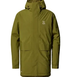 Haglöfs Vintertøj|Vintertøj-Salix Proof Mimic Parka Herre Oliven grønVægt: 954 gramMateriale: 100% genanvendt PROOF™ (Bluesign® -godkendt)Haglöfs Salix Proof Mimic Parka er en funktionel og bæredygtig vinterjakke, designet til at modstå selv de koldeste og mest våde vejrforhold. Parkaen er fremstillet med Haglöfs' PROOF™-teknologi, som gør jakken fuldt vandtæt og åndbar, så du kan forblive tør og komfortabel hele dagen.Jakken er foret med Mimic-materiale, der imiterer dun og giver en varm, letvægtsisolering – perfekt til kolde vinterdage. Den justerbare hætte, de praktiske lommer og de forstærkede skuldre giver ekstra funktionalitet og holdbarhed. Med et klassisk, stilfuldt design og bæredygtige materialer er Salix Proof Mimic Parka det ideelle valg til både byliv og friluftsliv, for dem der søger komfort og beskyttelse uden at gå på kompromis med miljøet.Detaljer:- 2 lags PROOF™ membran (Vind- og vandtæt)- Vandtæthed: vandsøjleværdi 10.000 mm- Åndbarhed: 10.000 g/m2/24 timer- Isoleret med Mimic SILVER pladeisolering - 2 forlommer og 1 indvendig lomme- Justerbar hætte- Justerbare ærmekanter- Reflekslogo ved lænden Detaljer